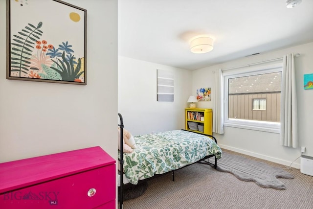 carpeted bedroom with baseboards and visible vents