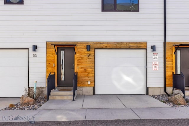 property entrance with a garage