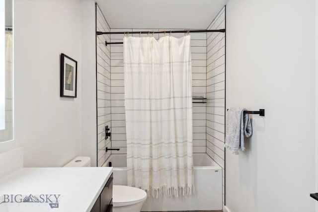 full bathroom featuring shower / tub combo with curtain, vanity, and toilet