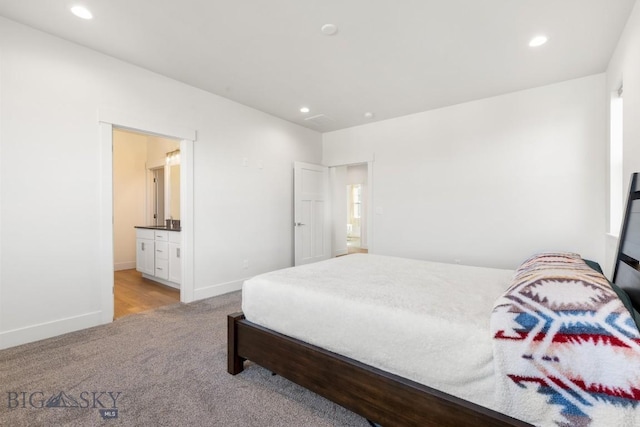 bedroom with light carpet, baseboards, and recessed lighting