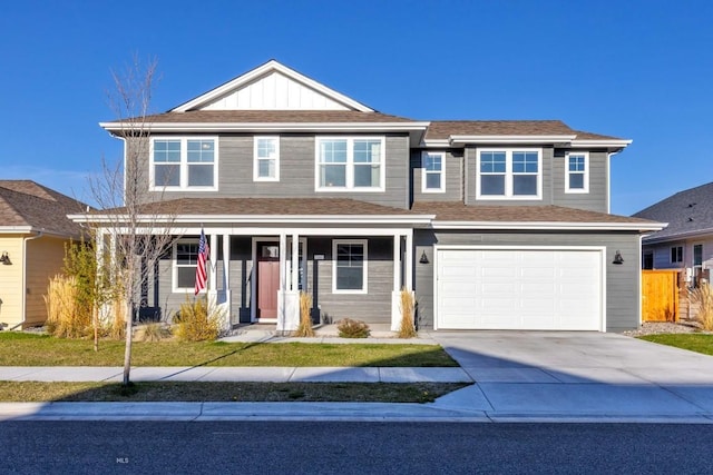 traditional-style home with covered porch, a garage, fence, concrete driveway, and board and batten siding