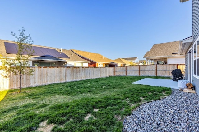 view of yard featuring a patio area and a fenced backyard