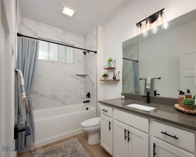 bathroom featuring toilet, vanity, wood finished floors, and shower / bathtub combination with curtain