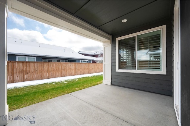 view of patio featuring fence