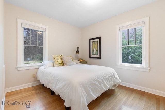 1014 S 6th St, Bozeman, MT 59715 - bedroom featuring wood finished floors and baseboards
