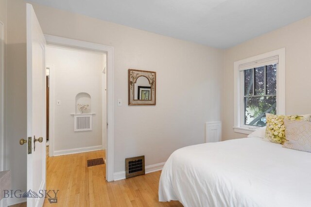 1014 S 6th St, Bozeman, MT 59715 - bedroom with light wood finished floors, baseboards, and visible vents