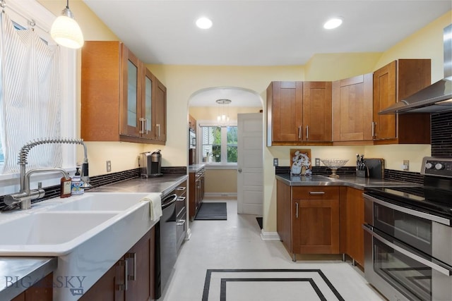 1014 S 6th St, Bozeman, MT 59715 - kitchen with a sink, black dishwasher, wall chimney exhaust hood, stainless steel countertops, and double oven range