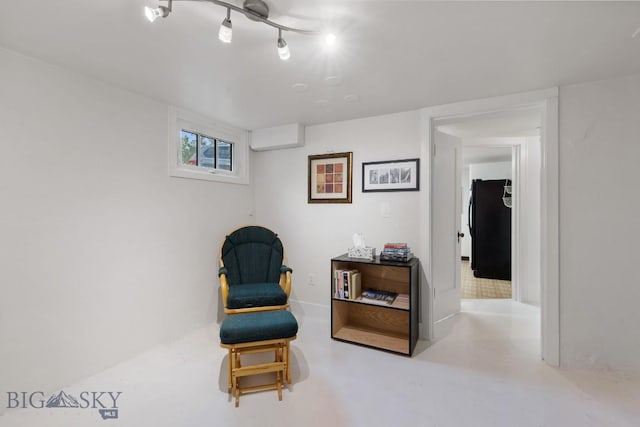 1014 S 6th St, Bozeman, MT 59715 - living area featuring concrete flooring and an AC wall unit