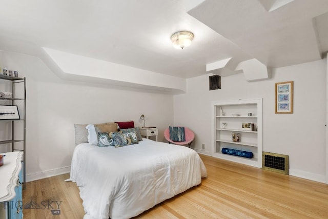 1014 S 6th St, Bozeman, MT 59715 - bedroom with baseboards, visible vents, and wood finished floors