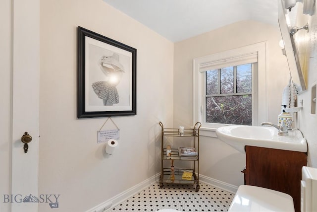 1014 S 6th St, Bozeman, MT 59715 - half bath with baseboards, vanity, and toilet