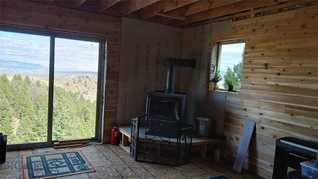 1842 Skyline Rd, Three Forks, MT 59752 - living room featuring a wood stove and wooden walls