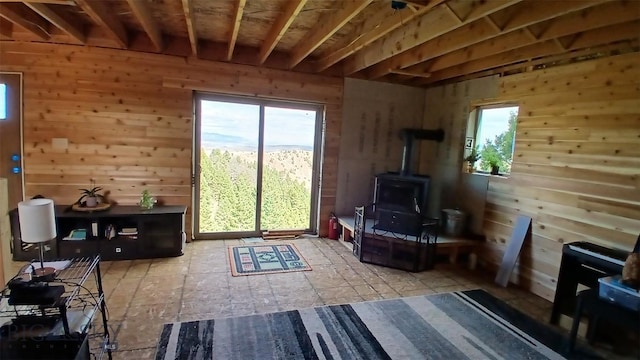1842 Skyline Rd, Three Forks, MT 59752 - living area featuring a wood stove and wooden walls