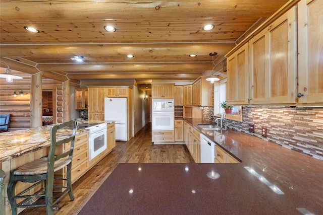 kitchen featuring wooden ceiling, white appliances, rustic walls, wood-type flooring, and a sink