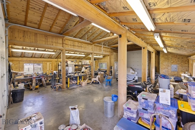 miscellaneous room with a workshop area and concrete flooring