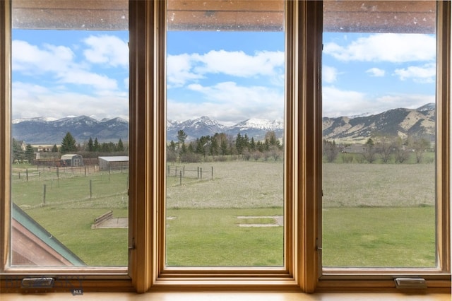 doorway featuring a rural view and a mountain view