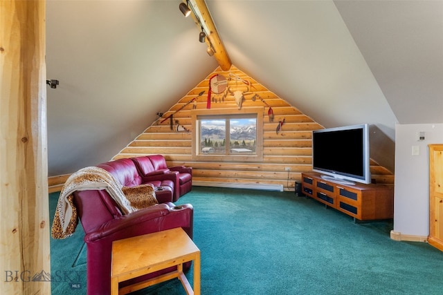 carpeted living room with track lighting, rustic walls, and vaulted ceiling