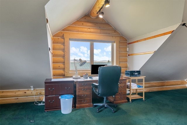 office with rail lighting, log walls, lofted ceiling, and dark carpet