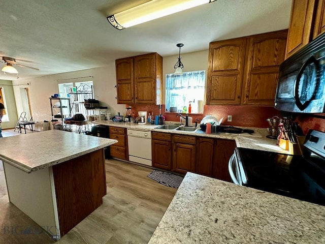 200 Missoula, Butte, MT 59701 - kitchen featuring white dishwasher, a sink, a wealth of natural light, electric range oven, and black microwave