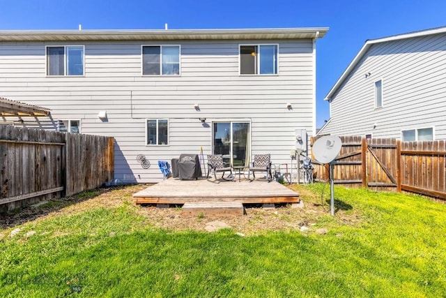 116 Michael Grove Ave, Bozeman, MT 59718 - rear view of property with a yard, a wooden deck, and a fenced backyard