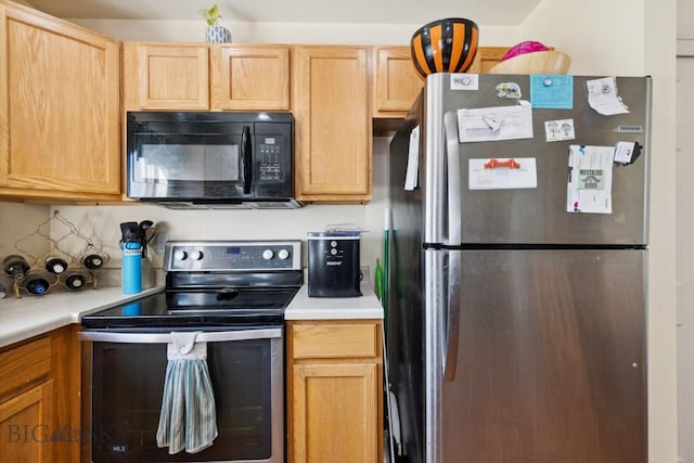 116 Michael Grove Ave, Bozeman, MT 59718 - kitchen featuring light countertops, stainless steel appliances, light brown cabinets, and decorative backsplash