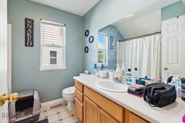 116 Michael Grove Ave, Bozeman, MT 59718 - full bathroom featuring a shower with curtain, toilet, baseboards, visible vents, and vanity