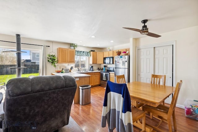 116 Michael Grove Ave, Bozeman, MT 59718 - dining room featuring light wood finished floors, a ceiling fan, and recessed lighting