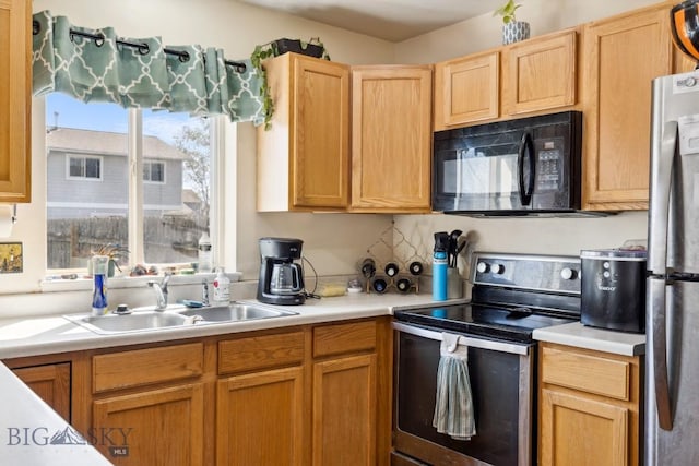 116 Michael Grove Ave, Bozeman, MT 59718 - kitchen featuring a sink, light countertops, and appliances with stainless steel finishes