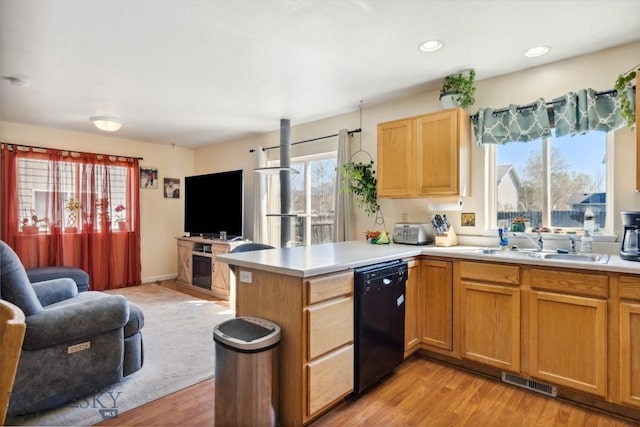 116 Michael Grove Ave, Bozeman, MT 59718 - kitchen with a peninsula, visible vents, dishwasher, open floor plan, and light countertops