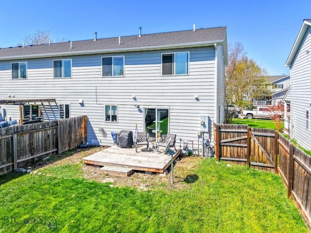 116 Michael Grove Ave, Bozeman, MT 59718 - back of house with a yard, a deck, and a fenced backyard