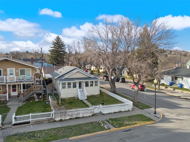 502 W Front St, Livingston, MT 59047 - view of front of property featuring a fenced front yard, stairway, and a residential view