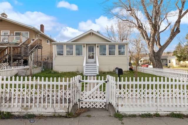 502 W Front St, Livingston, MT 59047 - bungalow-style home featuring a gate, stairway, a front yard, a fenced front yard, and entry steps