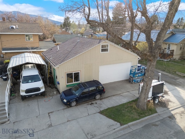 502 W Front St, Livingston, MT 59047 - view of front of home featuring roof with shingles and a garage