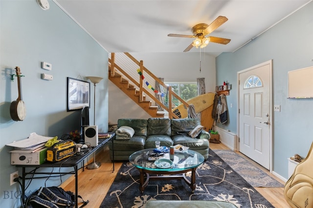 502 W Front St, Livingston, MT 59047 - living area with wood finished floors, a ceiling fan, and stairs
