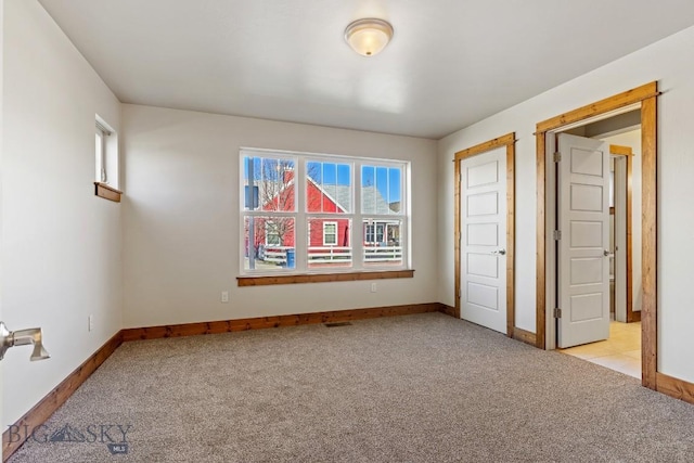 3598 Annie St, Bozeman, MT 59718 - unfurnished room featuring light carpet, plenty of natural light, and baseboards