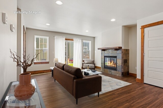 3598 Annie St, Bozeman, MT 59718 - living area featuring a tiled fireplace, wood finished floors, baseboards, and recessed lighting