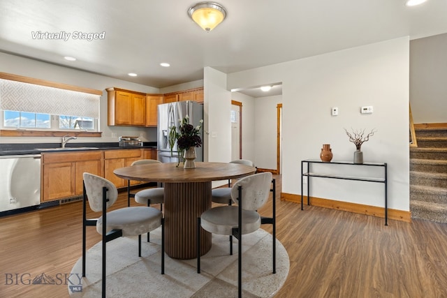 3598 Annie St, Bozeman, MT 59718 - dining space with wood finished floors, baseboards, stairs, and recessed lighting
