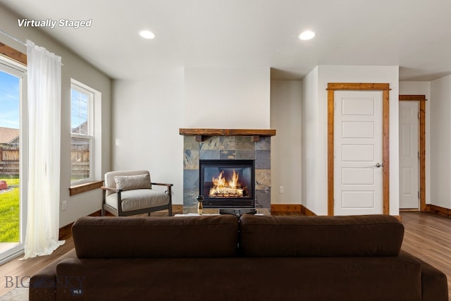 3598 Annie St, Bozeman, MT 59718 - living area with a fireplace, wood finished floors, recessed lighting, and baseboards