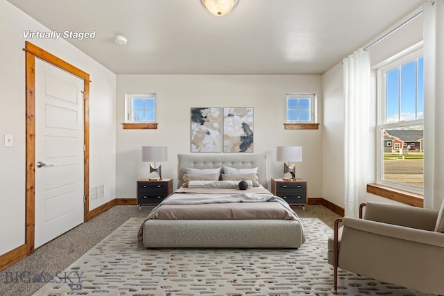 3598 Annie St, Bozeman, MT 59718 - carpeted bedroom with baseboards and multiple windows