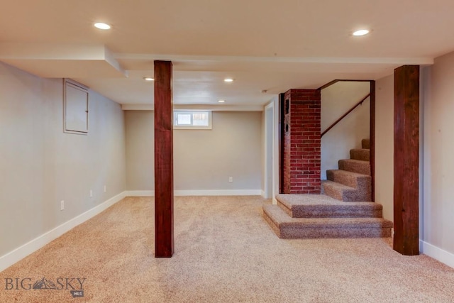 basement with recessed lighting and carpet
