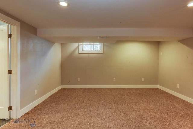 basement featuring baseboards, recessed lighting, and carpet floors