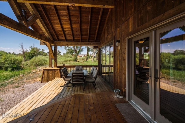 wooden terrace featuring outdoor dining space