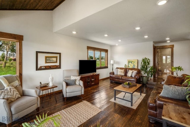 living room with wood finished floors, baseboards, and recessed lighting