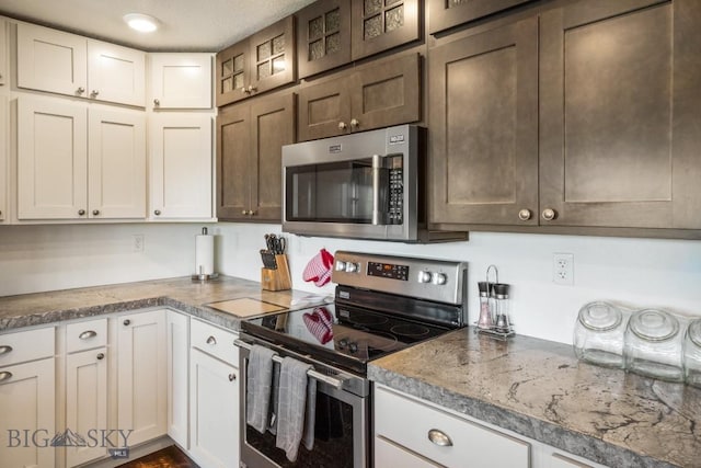 kitchen with stainless steel appliances and white cabinets