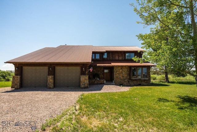 view of front of home with a front lawn, stone siding, an attached garage, and driveway