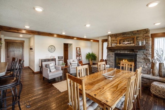 dining space featuring baseboards, a fireplace, recessed lighting, and wood finished floors