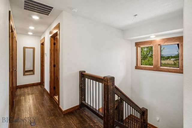corridor featuring baseboards, recessed lighting, an upstairs landing, and visible vents