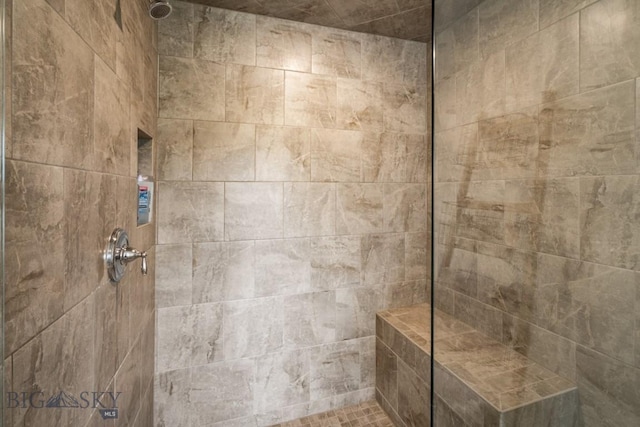 bathroom with tiled shower