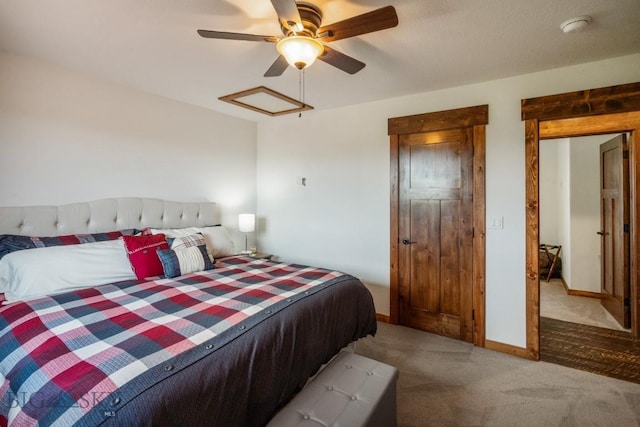 bedroom with carpet, baseboards, and ceiling fan