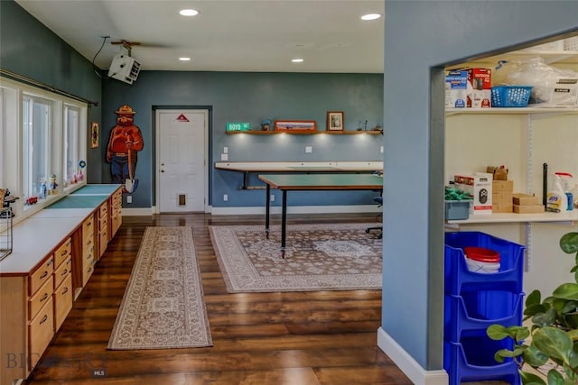 playroom with dark wood-type flooring, baseboards, and recessed lighting