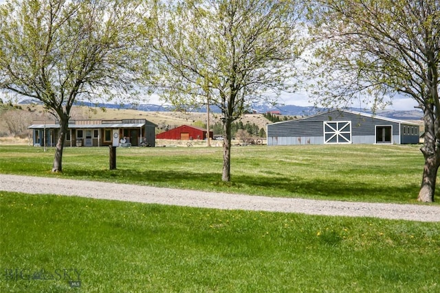 view of yard featuring an outbuilding and a barn